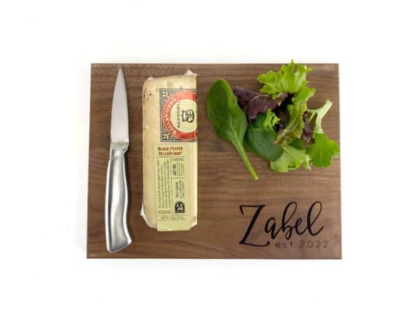 Image shows a hardwood personalized Cutting board