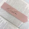 Pink leather bookmark on a bible